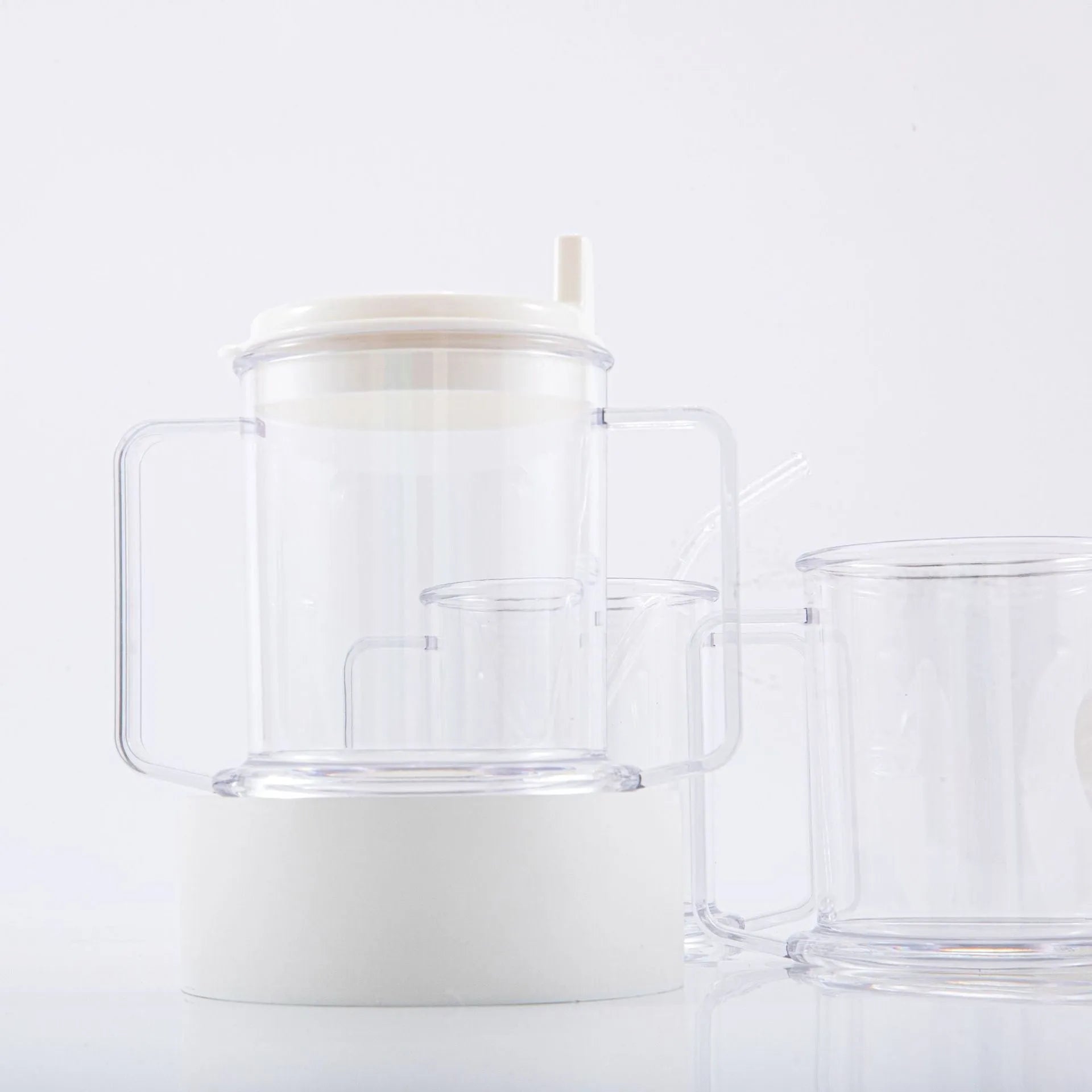 Transparent spill-proof drinking cup showing modern minimalist design