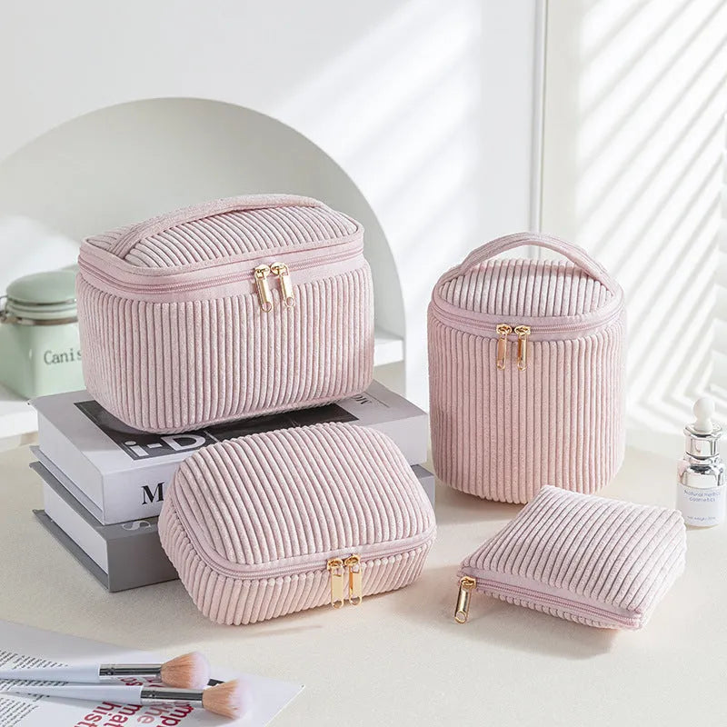 Four cube-style polyester makeup bags in pink, khaki, pink dots, and blue with dots colour options
