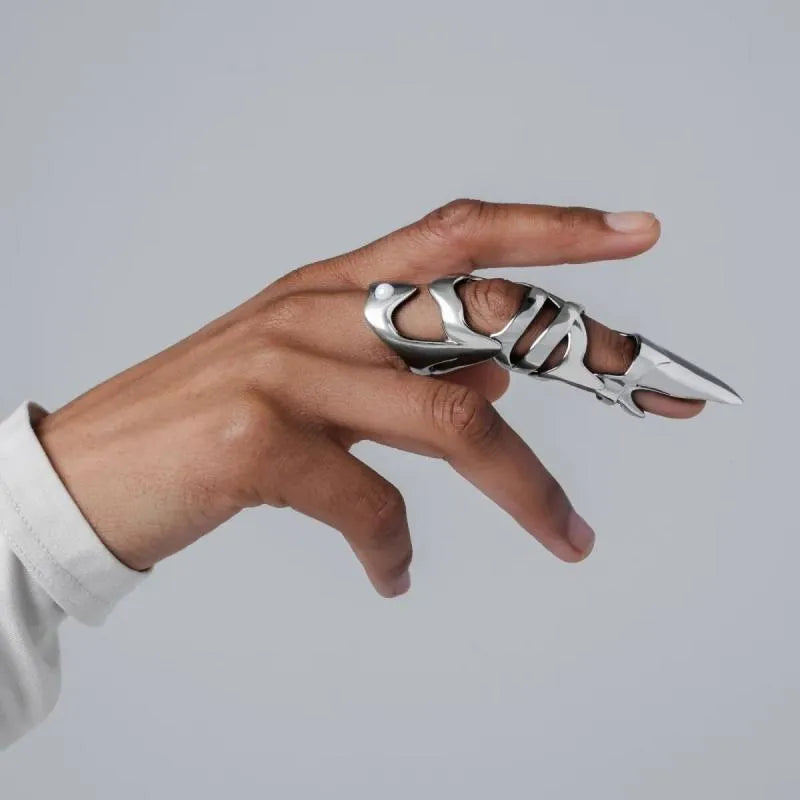 Silver-coloured punk armour finger stall ring made from alloy.