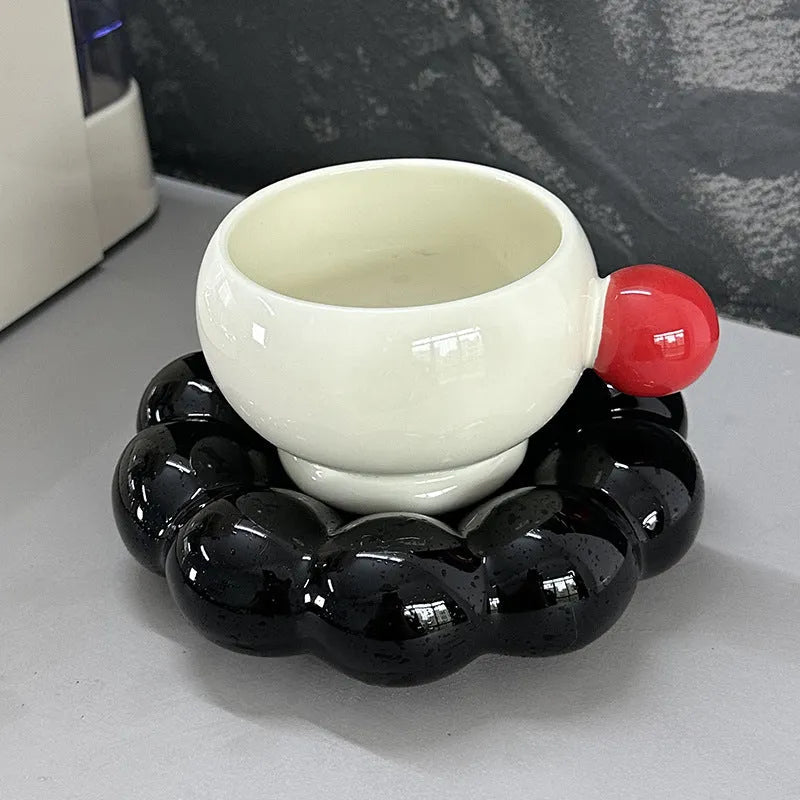 Ceramic coffee cup and saucer set in a simple solid colour, showing the 250ml cup resting on its matching dish.