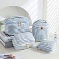 Four cube-style polyester makeup bags in pink, khaki, pink dots, and blue with dots colour options