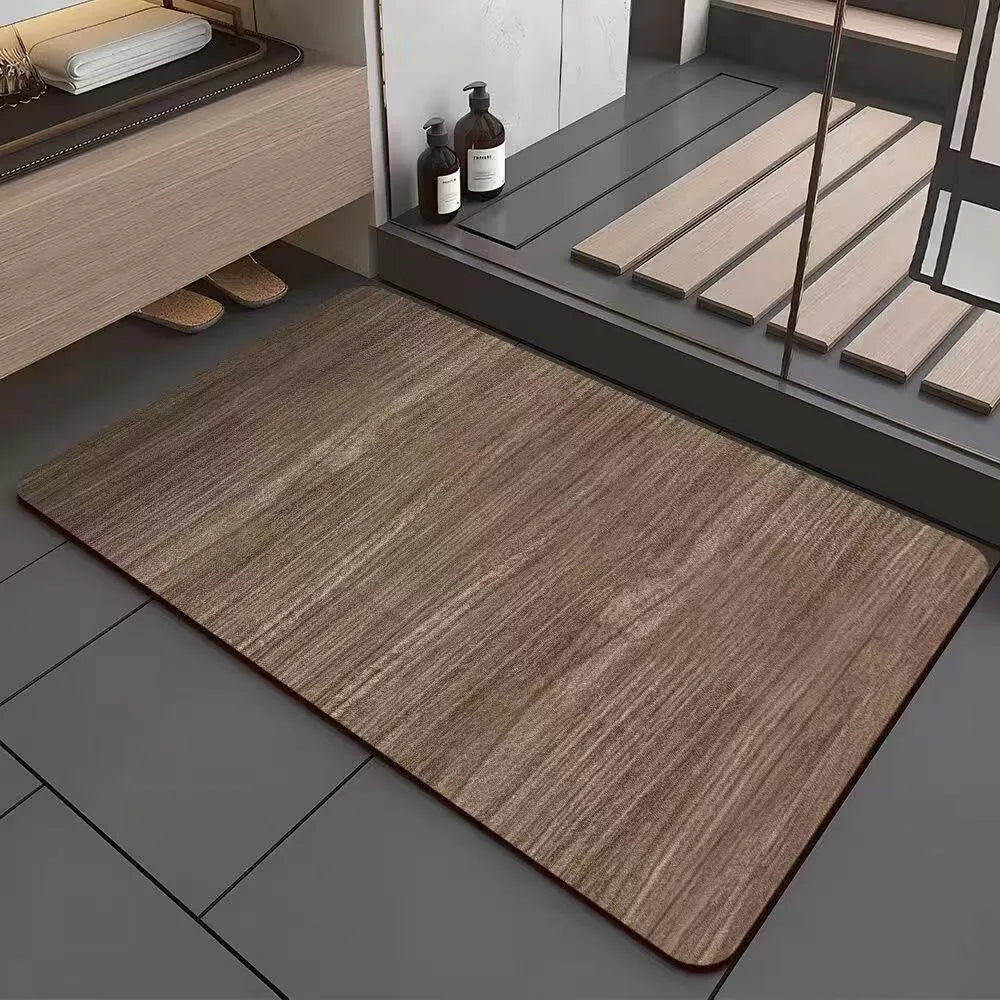 Square diatomite bathroom floor mat with wood grain geometric pattern in a bathroom setting.