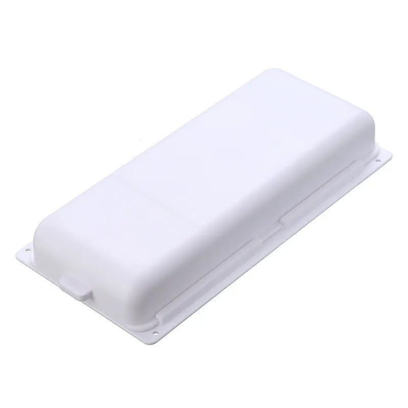 Small white plastic storage box with a grid pattern, shown adhered underneath a wooden table.