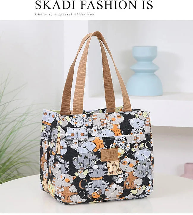 Women's printed canvas handbag with floral design and aluminium hardware in square shape