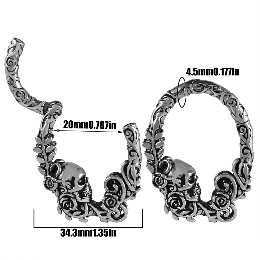 A pair of stainless steel totem pattern earrings with an electroplated finish, shown from the 15 available style options.