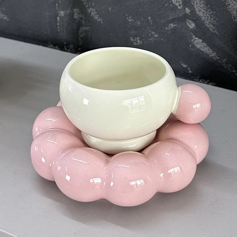 Ceramic coffee cup and saucer set in a simple solid colour, showing the 250ml cup resting on its matching dish.