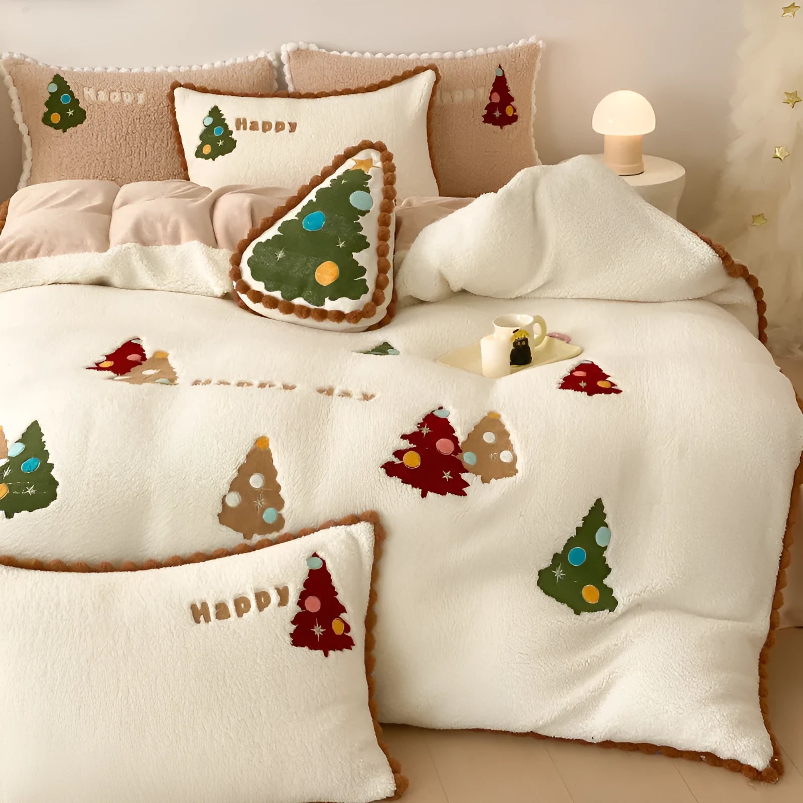 Bright yellow winter Christmas bedding four-piece set with cartoon pattern on a bed, showing fleece-lined quilt cover, sheet, and pillowcases.