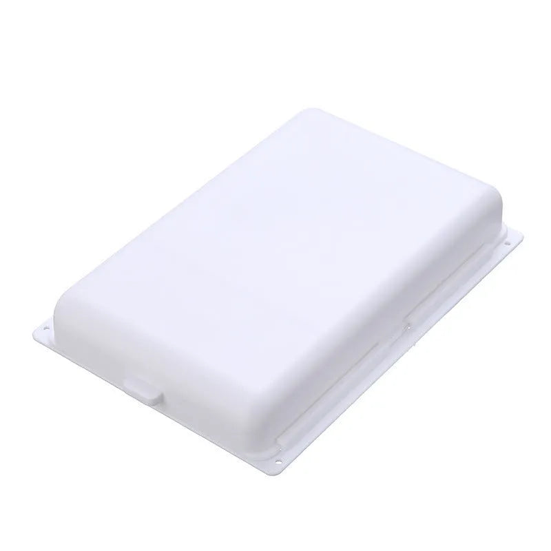 Small white plastic storage box with a grid pattern, shown adhered underneath a wooden table.