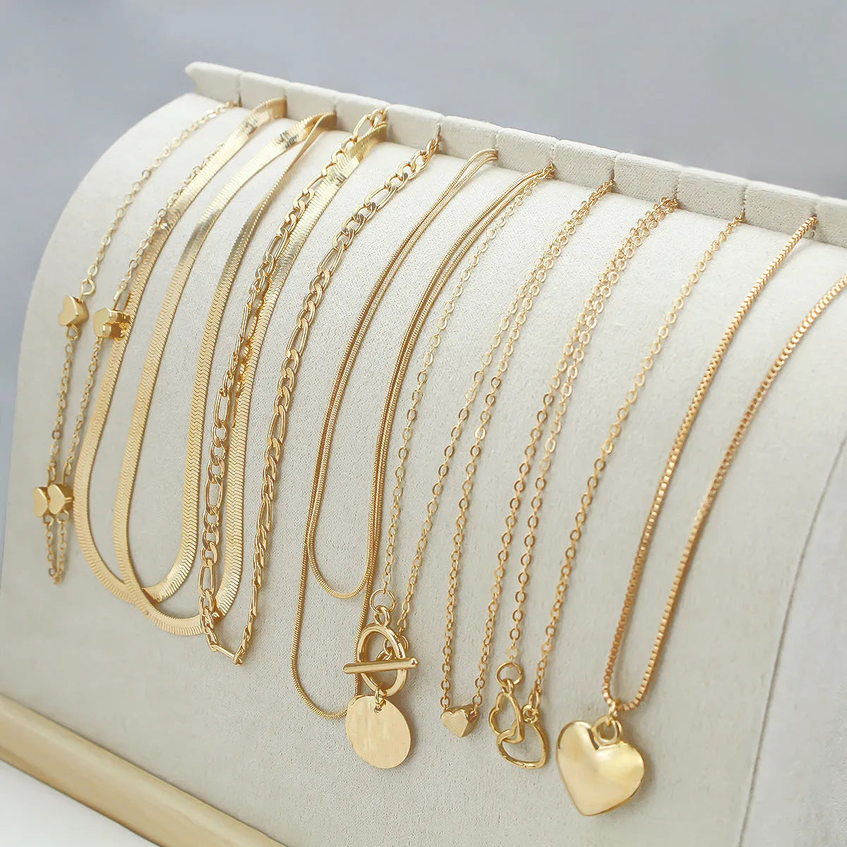 Gold necklace set with ten alloy pendants on adjustable snake bone chain