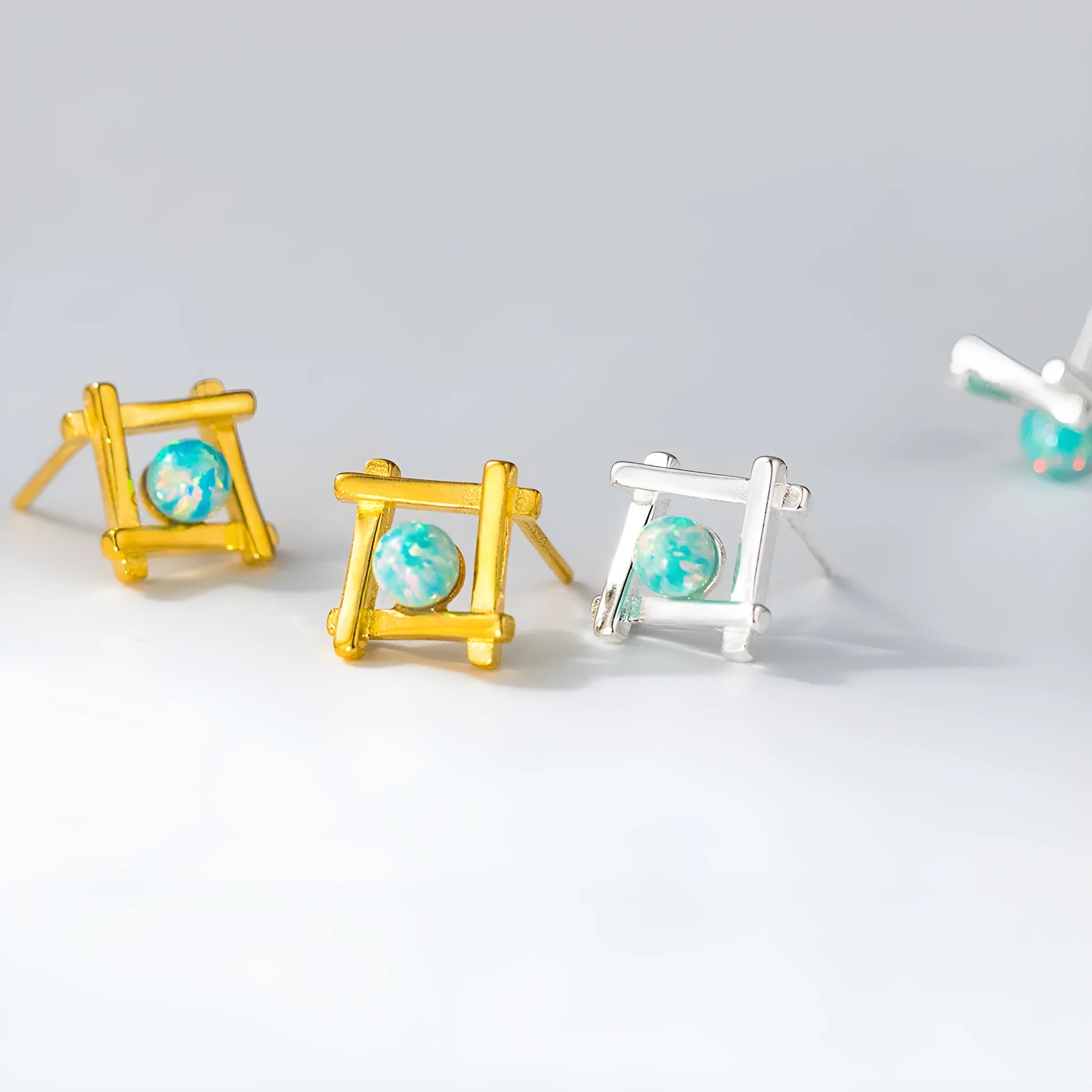 Women's geometric cross quadrangle stud earrings in sterling silver with gold or silver plating options
