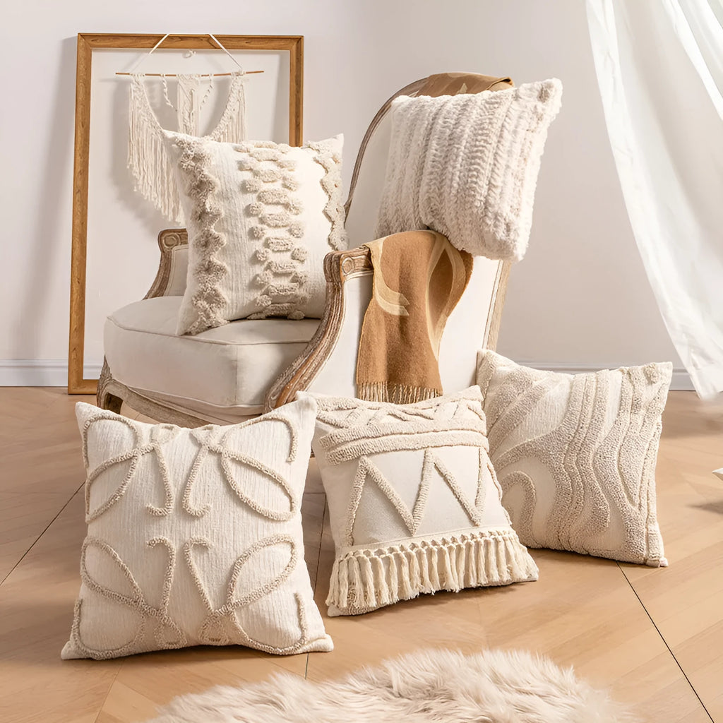 Knitted striped cushion cover with tassel trim in 45x45cm size on a sofa.