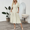 Light green commuter shirt dress with lapel collar and waist-tight fit