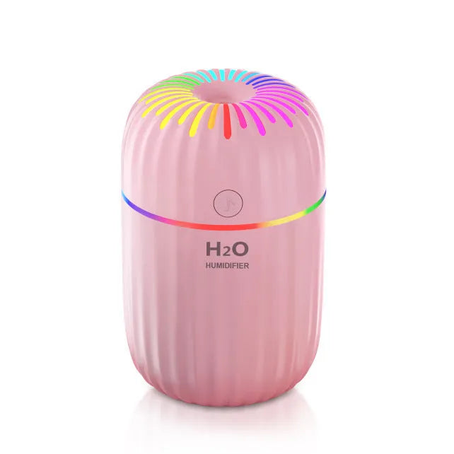 Compact green animal-shaped USB humidifier and aromatherapy diffuser on a desktop