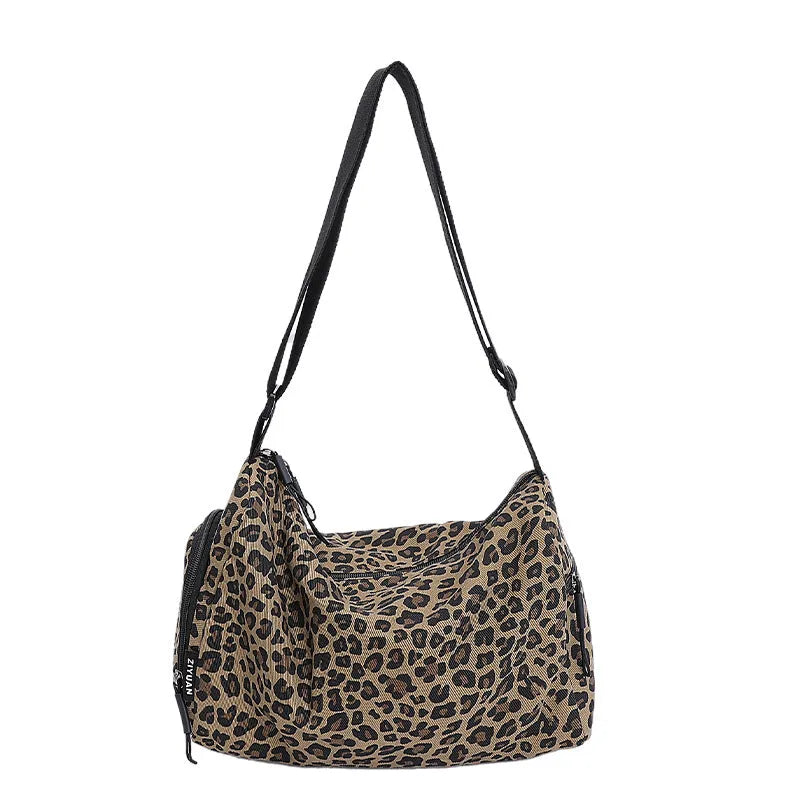 Sports style shoulder messenger bag in leopard print or stripes pattern with crossbody strap
