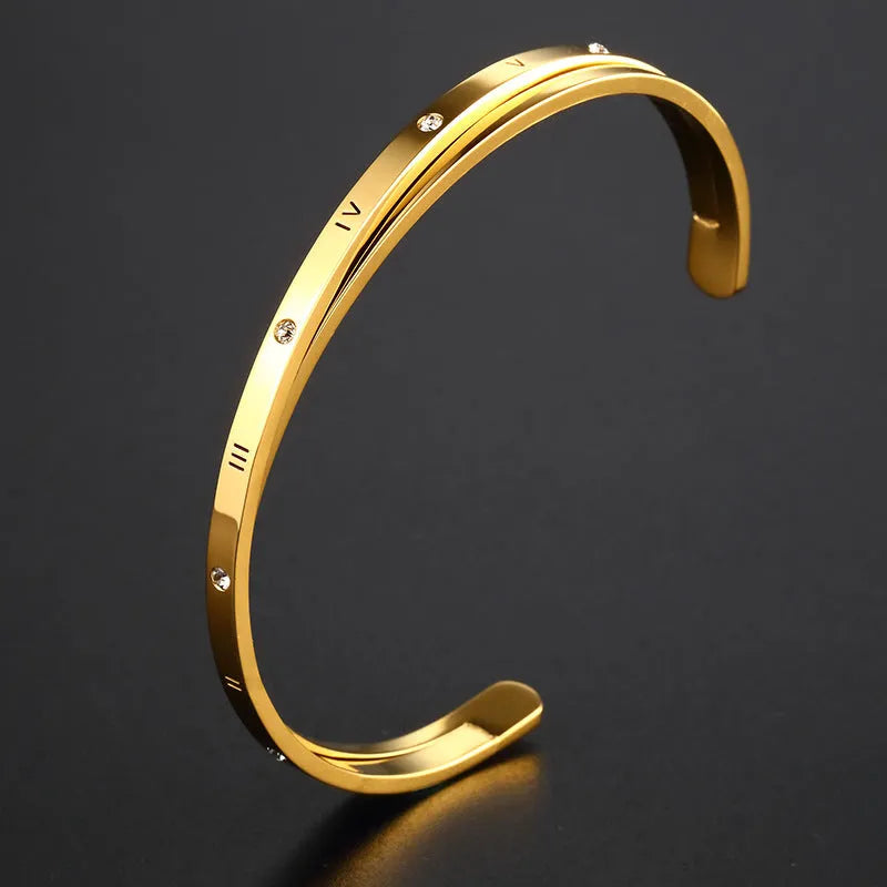 Open-ended adjustable bracelet with inlaid zircon detailing on love theme in rose gold steel colours
