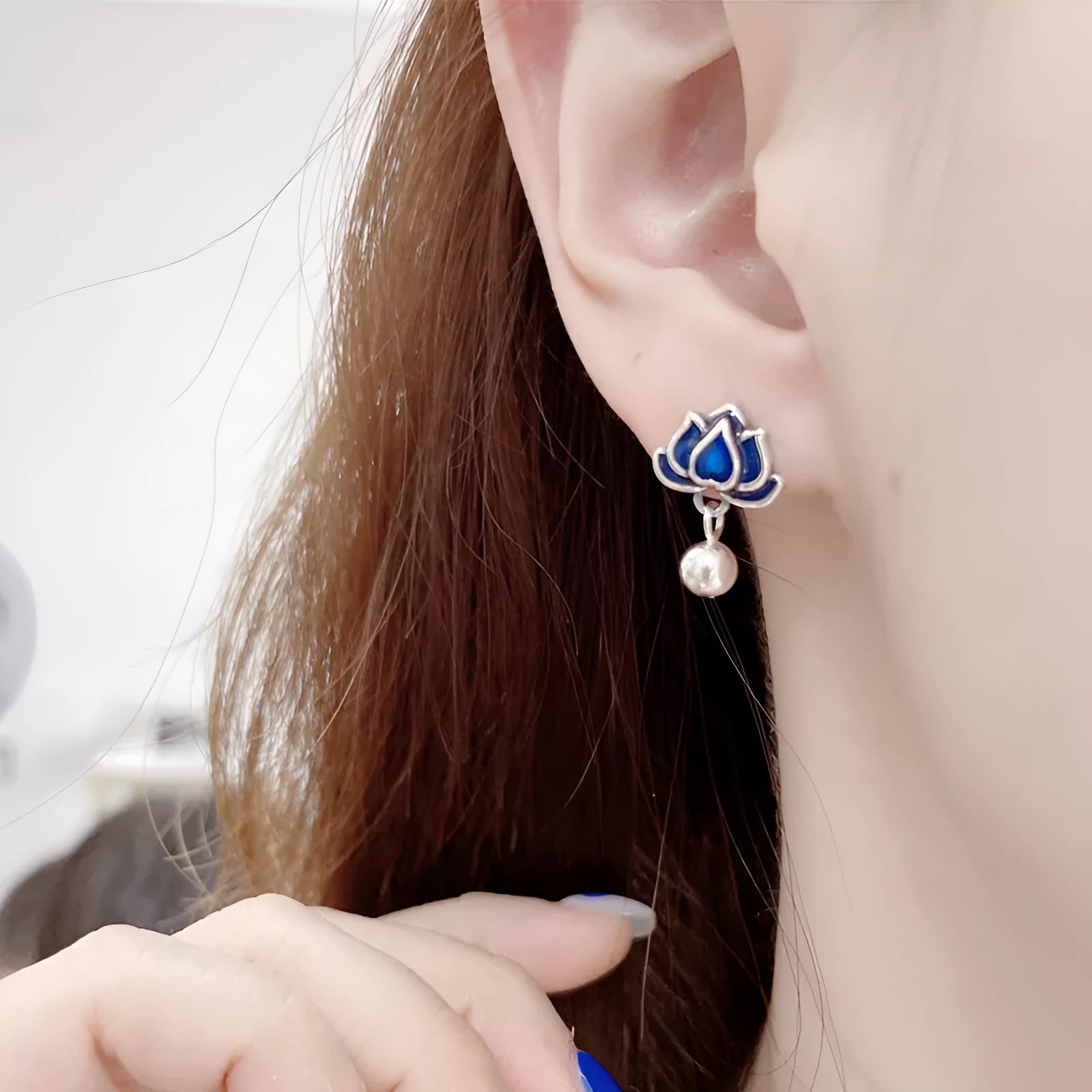 Blue lotus seedpod tassel stud earrings with flower shape, measuring 1.2cm wide.