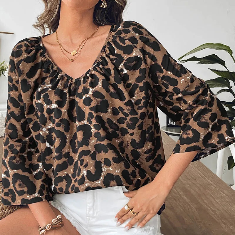 Women's leopard print V-neck pullover top with half sleeves in multicolour pattern