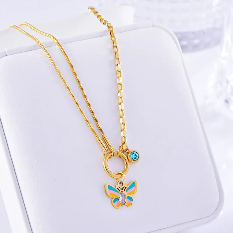 Gold coloured titanium steel necklace and bracelet set with colourful epoxy butterfly pendant