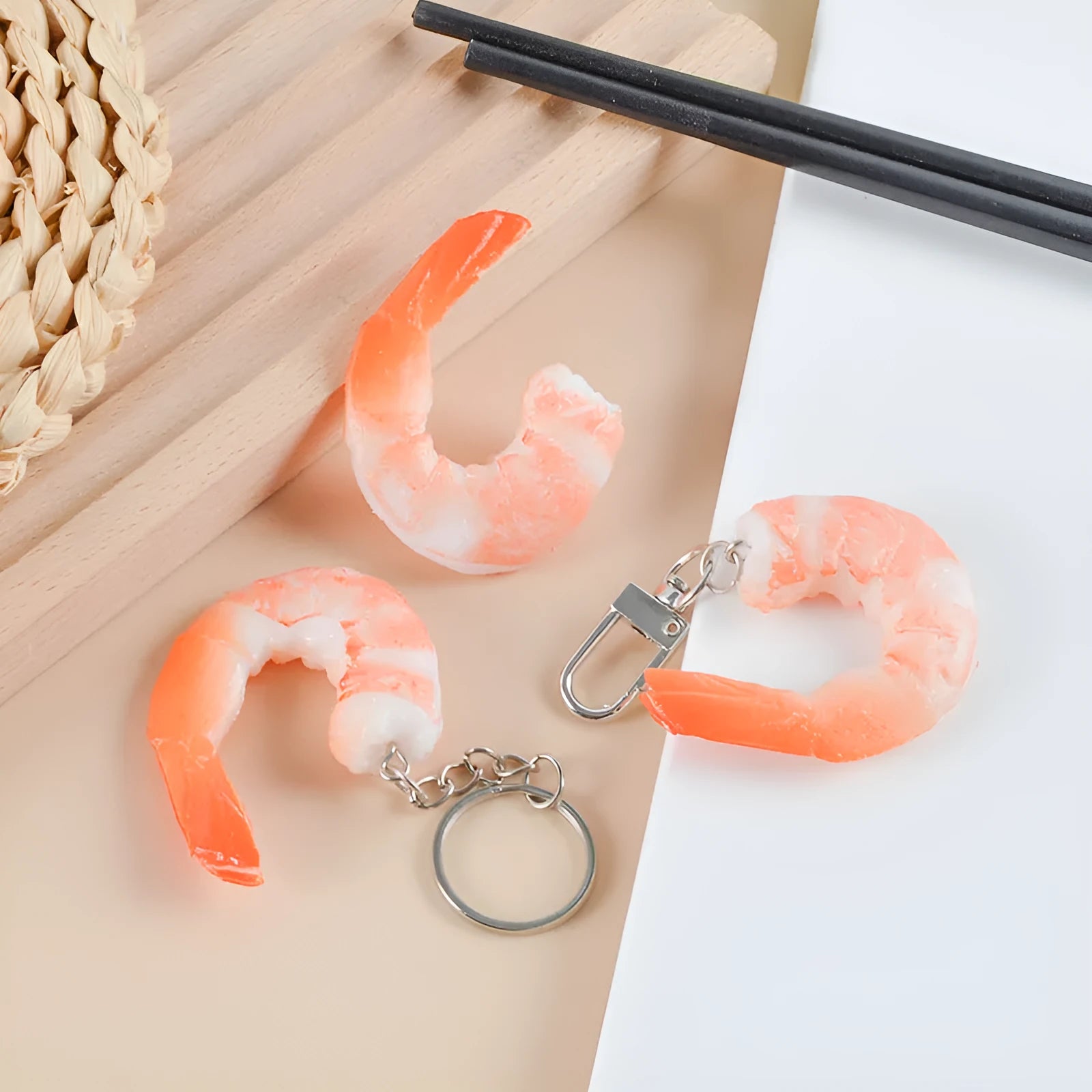 PVC injection moulded shrimp-shaped keychain with modern minimalist design