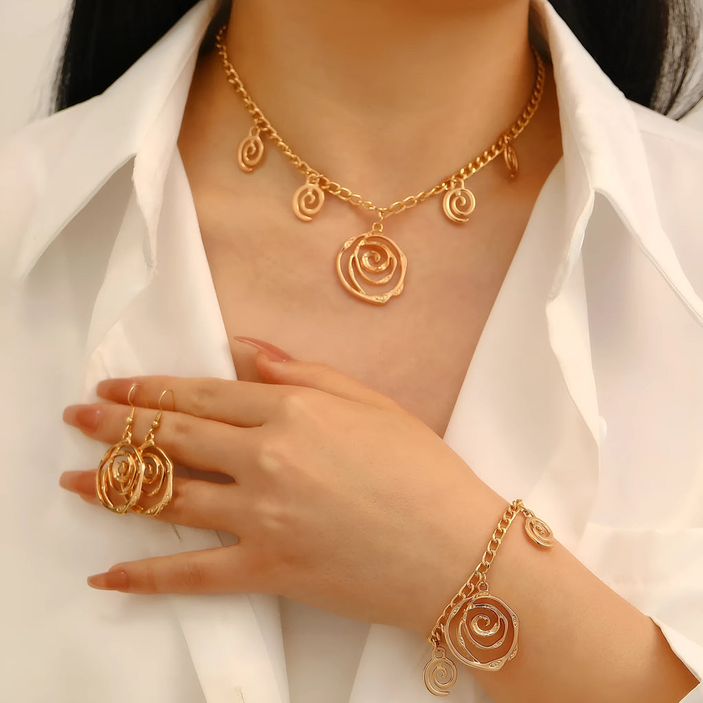 Spiral donut design alloy necklace, bracelet and earrings set in gold or silver electroplated finish.