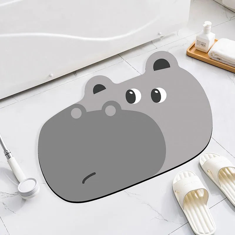 Diatomite bathroom absorbent mat in a cartoon animal design on a bathroom floor.