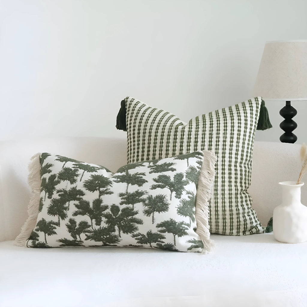 Green botanical pattern hotel sample pillow with tassel detail on linen cotton cover
