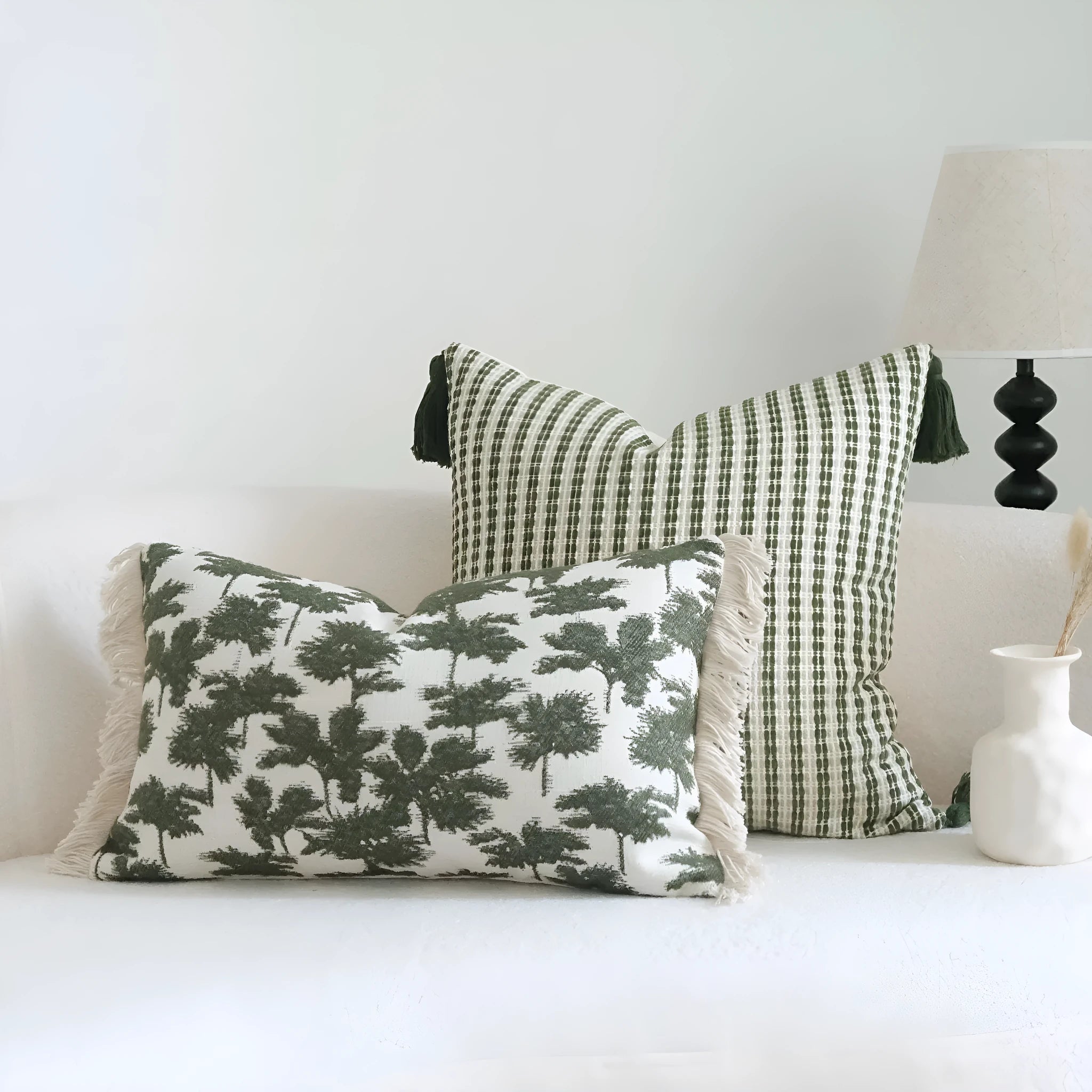 Green botanical pattern hotel sample pillow with tassel detail on linen cotton cover