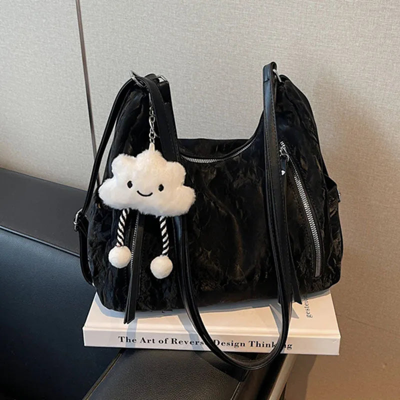 Women's soft PU fashion backpack in black with matching pendant accessory