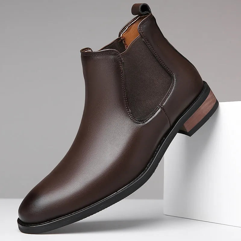 Men's black and light brown pointed toe Chelsea boots with a high-top design and rubber sole.