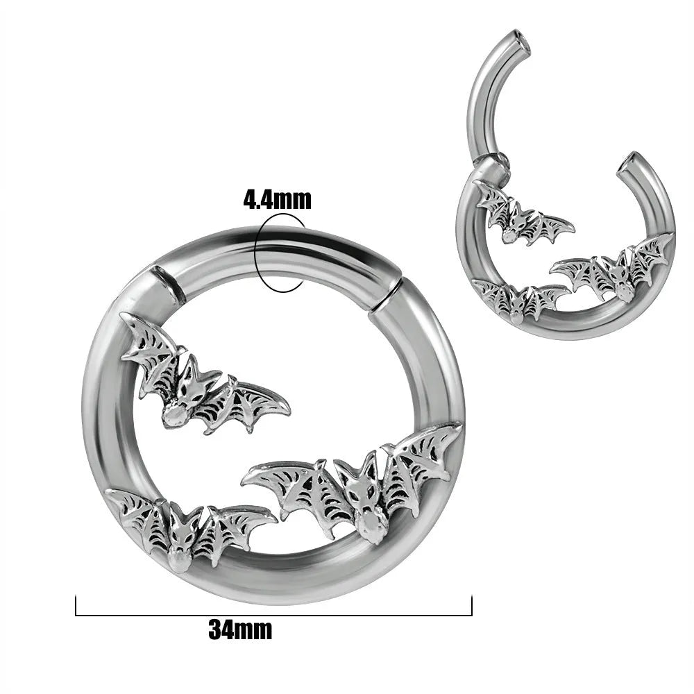 A pair of stainless steel totem pattern earrings with an electroplated finish, shown from the 15 available style options.