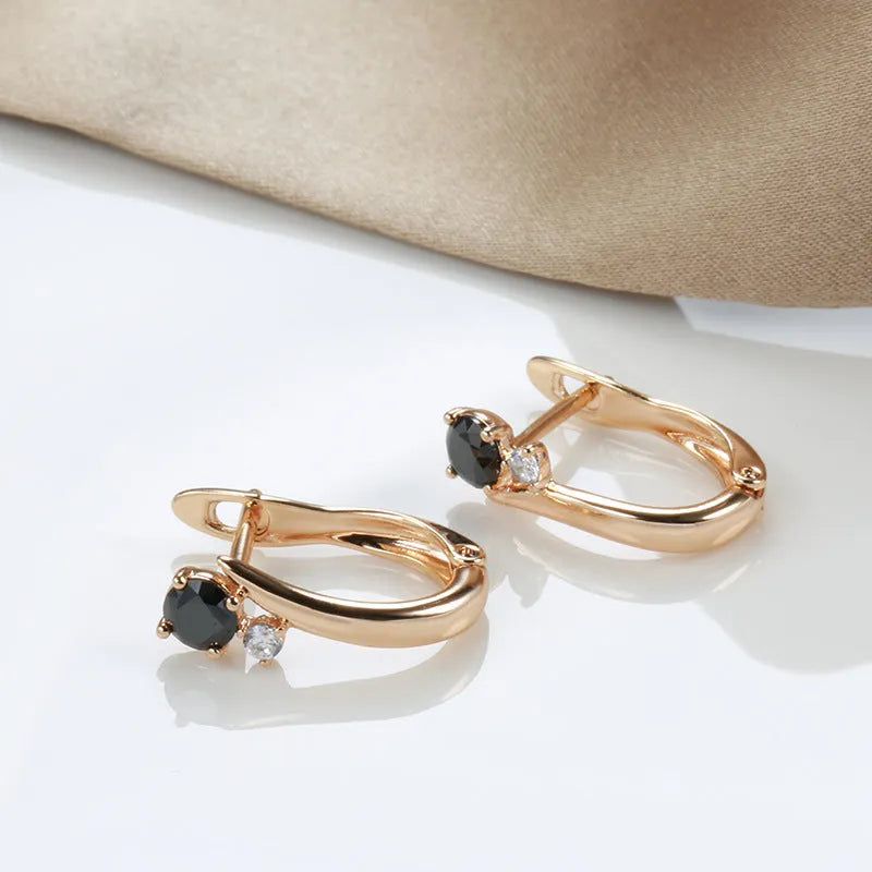 Gold drop earrings with black geometric stones in retro style design
