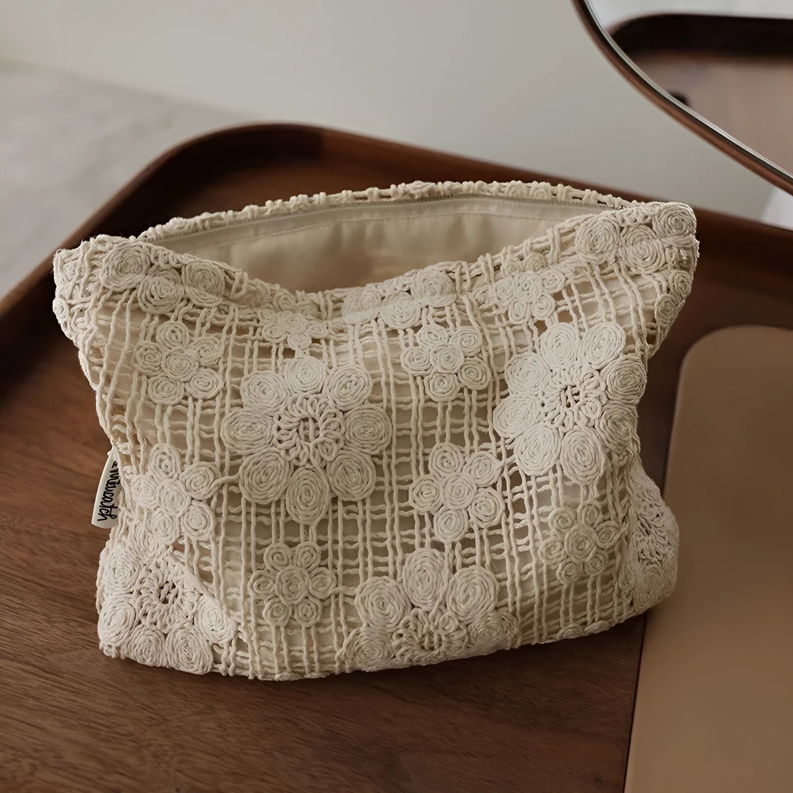 Handmade crocheted hollow flower cosmetic bag with ethnic embroidery on corduroy fabric