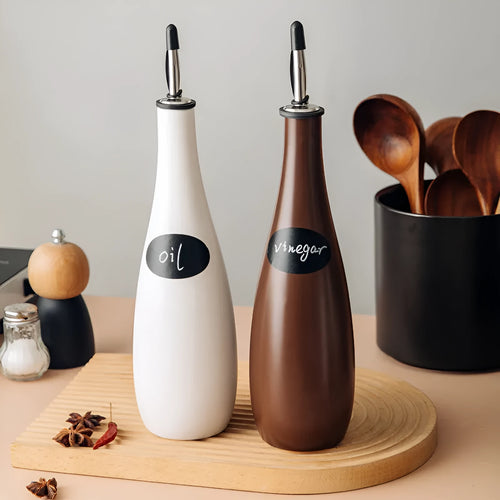 Ceramic oil pot with funnel in black, coffee, and white colour options, 650ml capacity.
