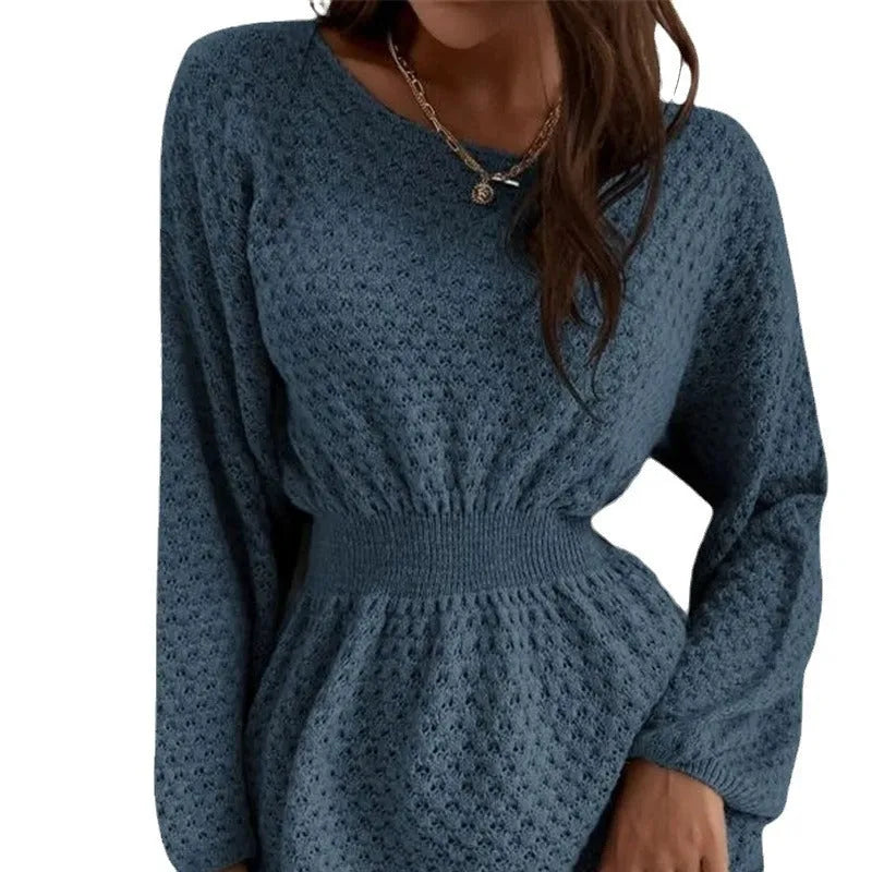 Blue women's knitted dress with hand-crocheted white flowers, a fitted waist, and a round neck.