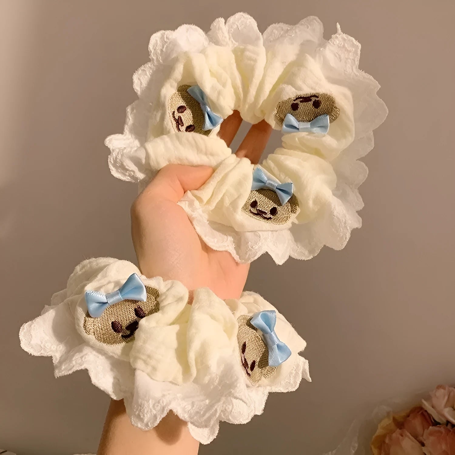 Blue bear bow and lace cloth hair ring with large intestine design on dark background