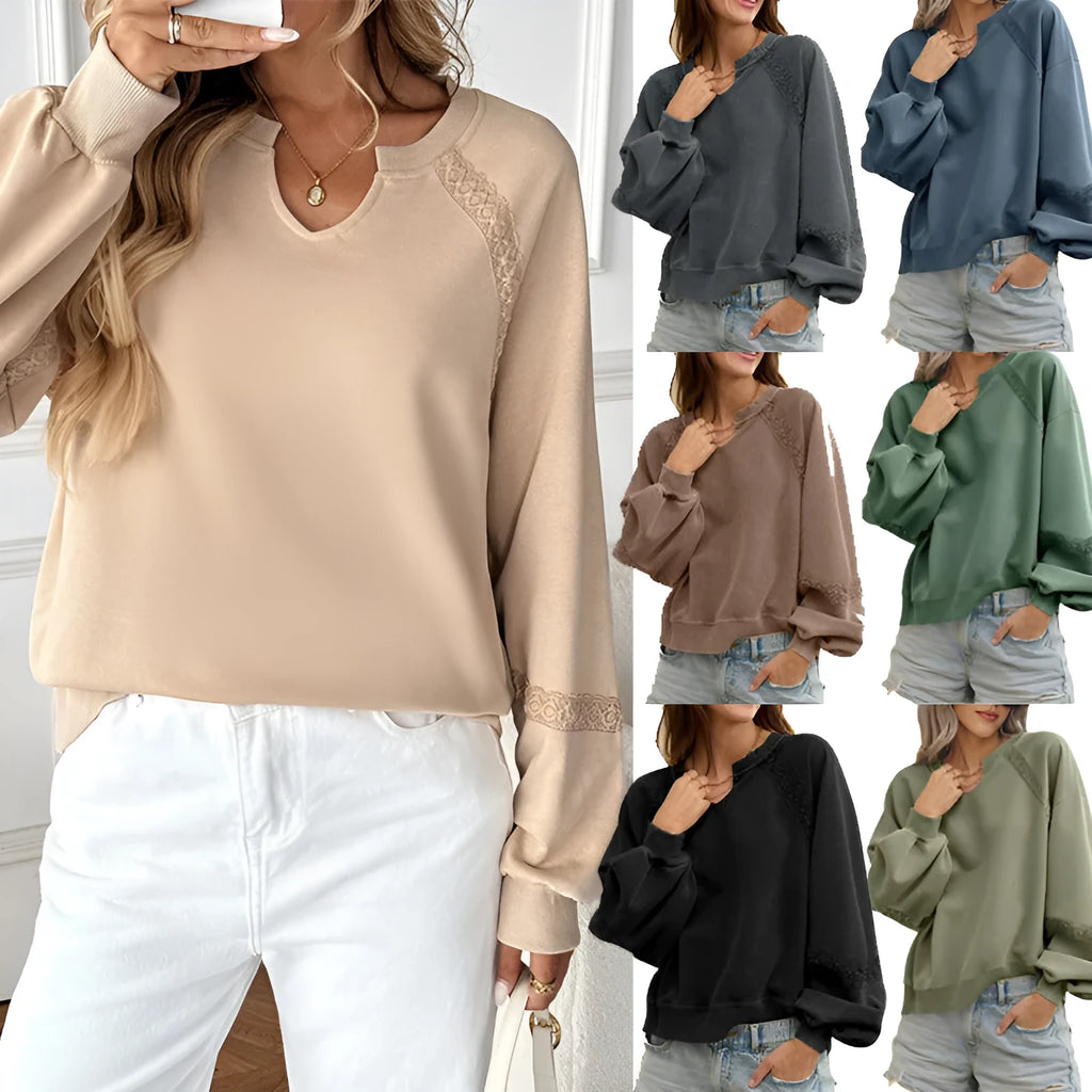 Women's solid colour sweater with a half-open collar featuring white stitching lace detail and long sleeves.