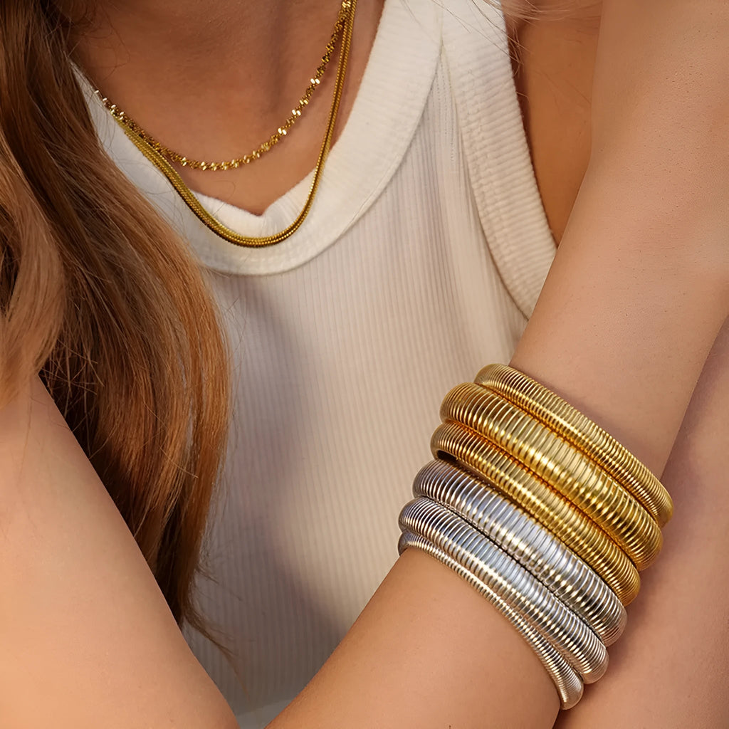 Women's elastic titanium steel bracelet with vertical stripe ring pattern in gold finish