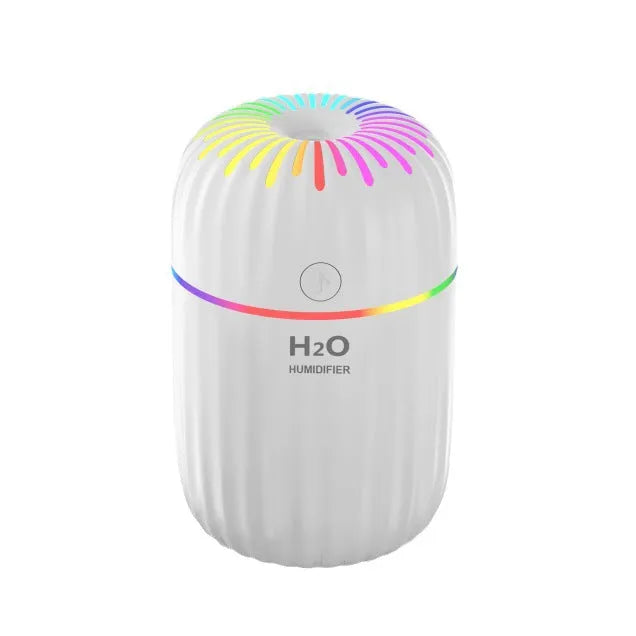 Compact green animal-shaped USB humidifier and aromatherapy diffuser on a desktop