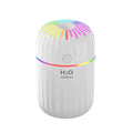 Compact green animal-shaped USB humidifier and aromatherapy diffuser on a desktop