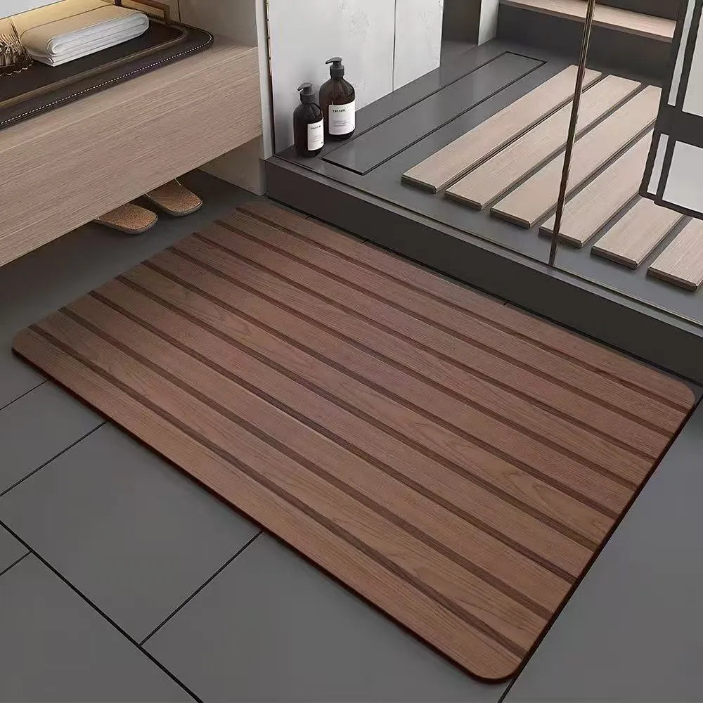Square diatomite bathroom floor mat with wood grain geometric pattern in a bathroom setting.