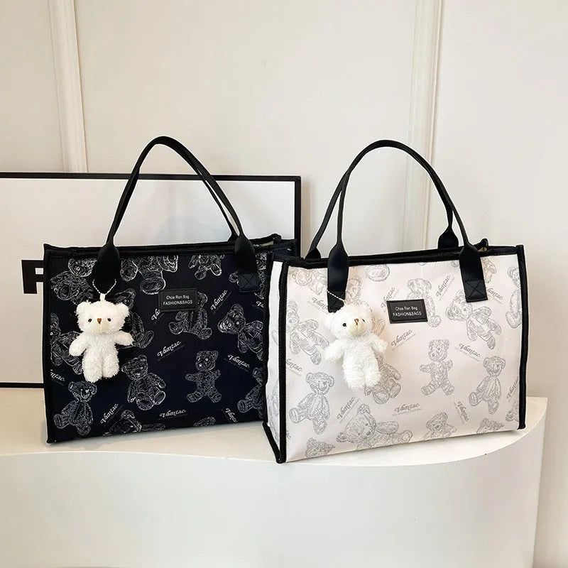 Women's black and white canvas tote bag with rhombus pattern and sandwich pocket design