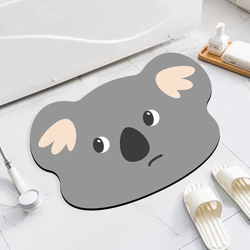 Diatomite bathroom absorbent mat in a cartoon animal design on a bathroom floor.