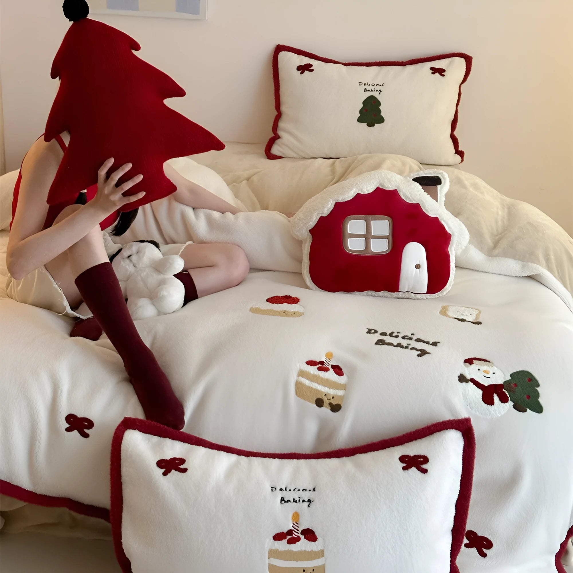 Christmas cartoon bedding four-piece set showing bed sheet, duvet cover and pillowcases with pastel milk cake pattern