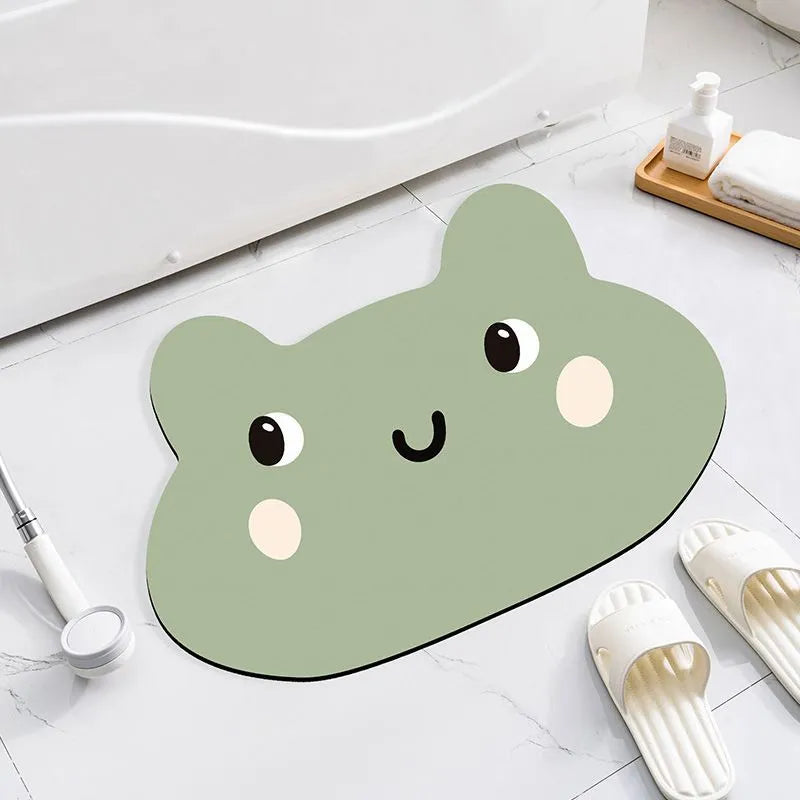 Diatomite bathroom absorbent mat in a cartoon animal design on a bathroom floor.