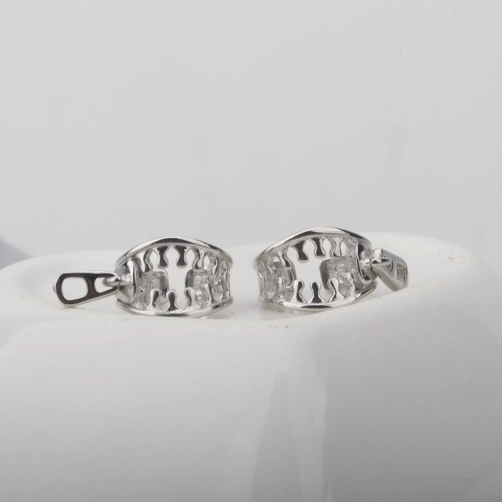 A pair of simple geometric copper clip-on earrings with a linear design on a white background.