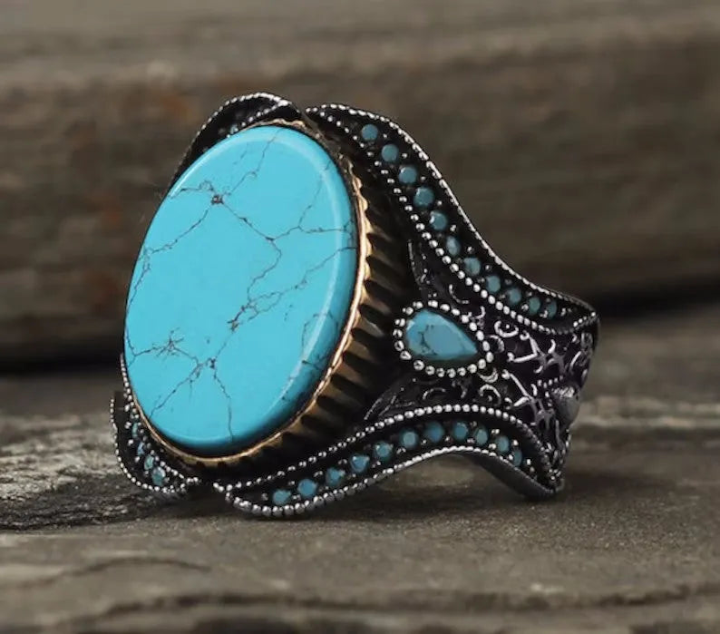 Men's antique silver alloy round band ring showing simple turquoise colour on finger
