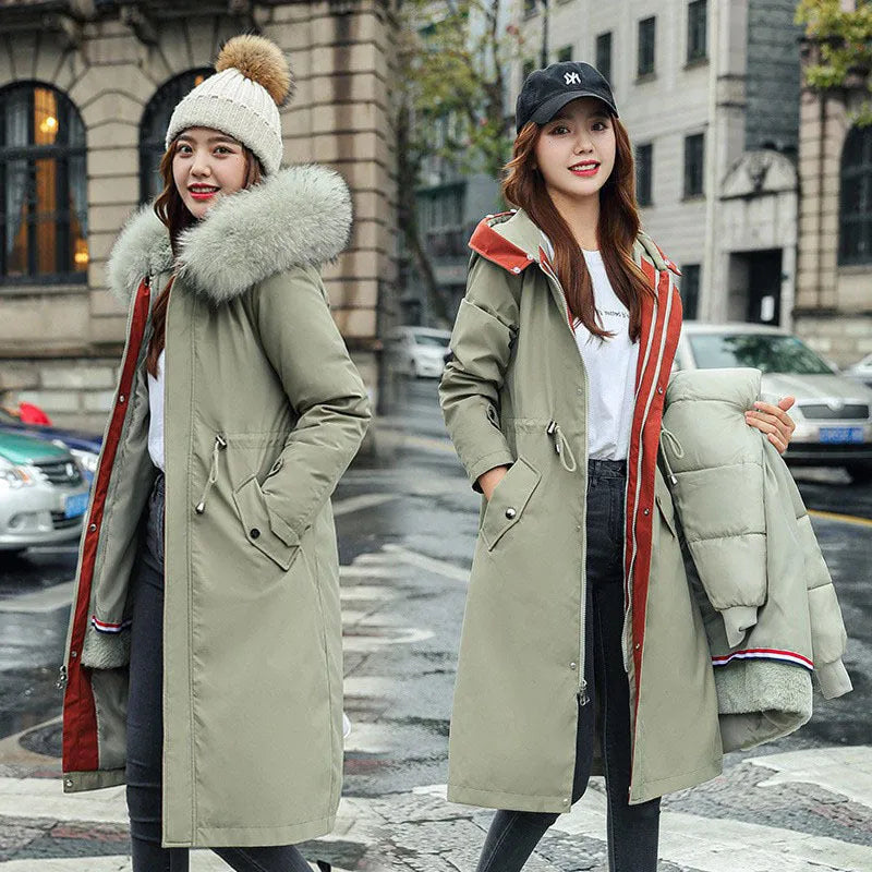 Long beige women's trench coat with cotton-padded fleece construction on a hanger.
