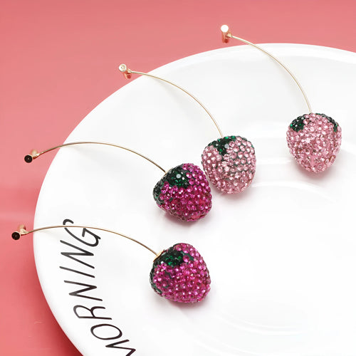Women's geometric strawberry earrings with spot drill detail in red zinc alloy.