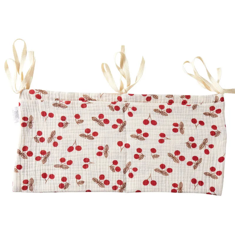 Cotton double layer baby bedside buggy bag in camel colour with tie straps attached to a pram handle