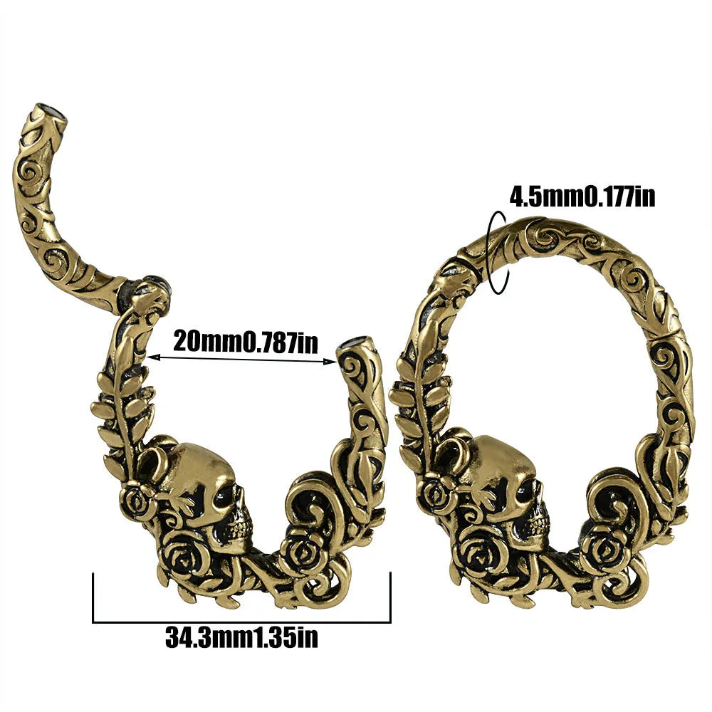 A pair of stainless steel totem pattern earrings with an electroplated finish, shown from the 15 available style options.